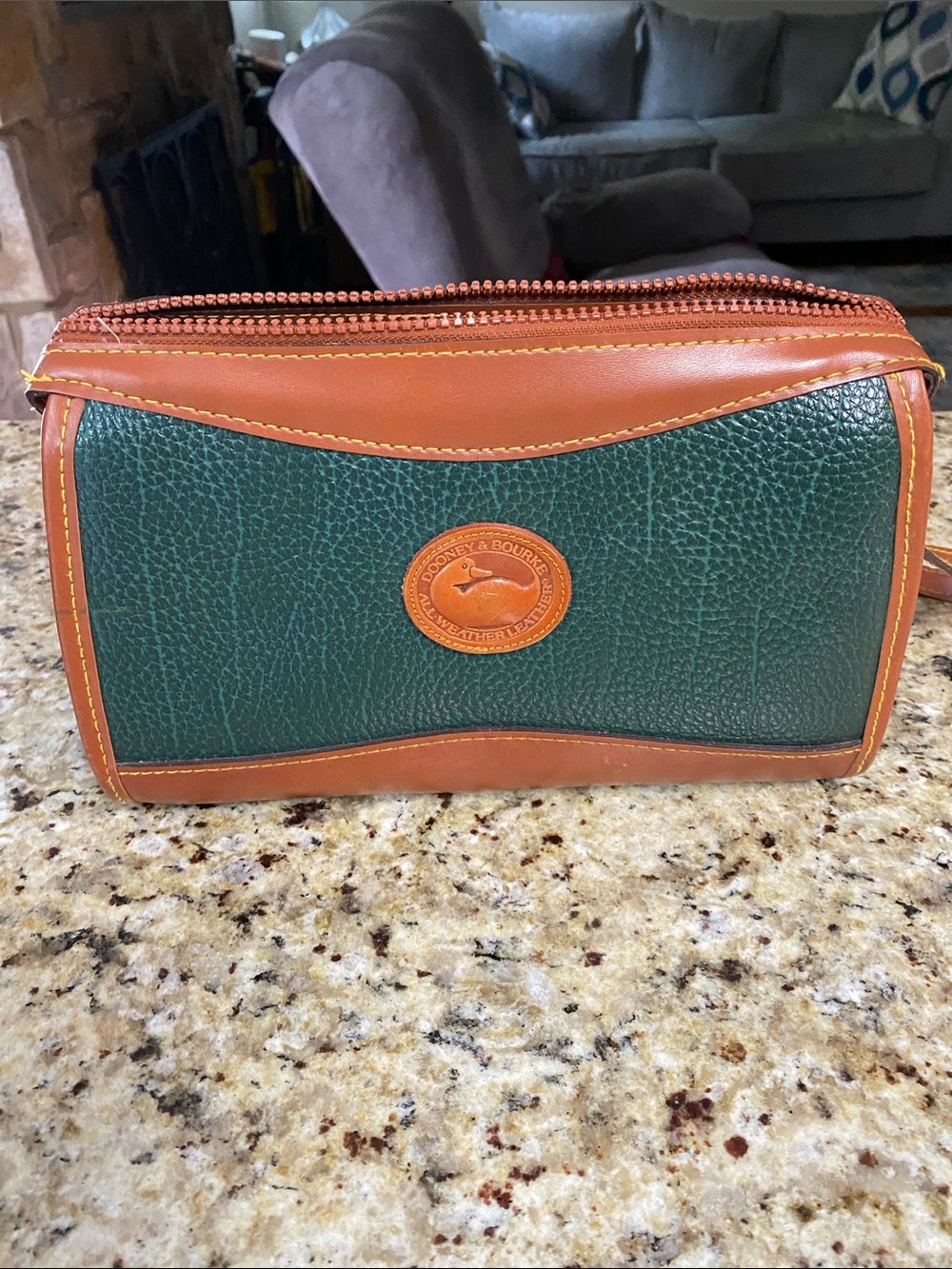 Dooney & Bourke Green Pebbled Leather and Brown Trim Crossbody or small bag.